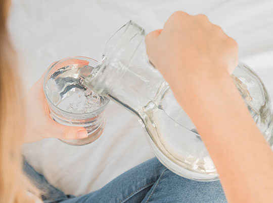skin-hydration-filling-glass-water filling glass of drinking water for skin hydration